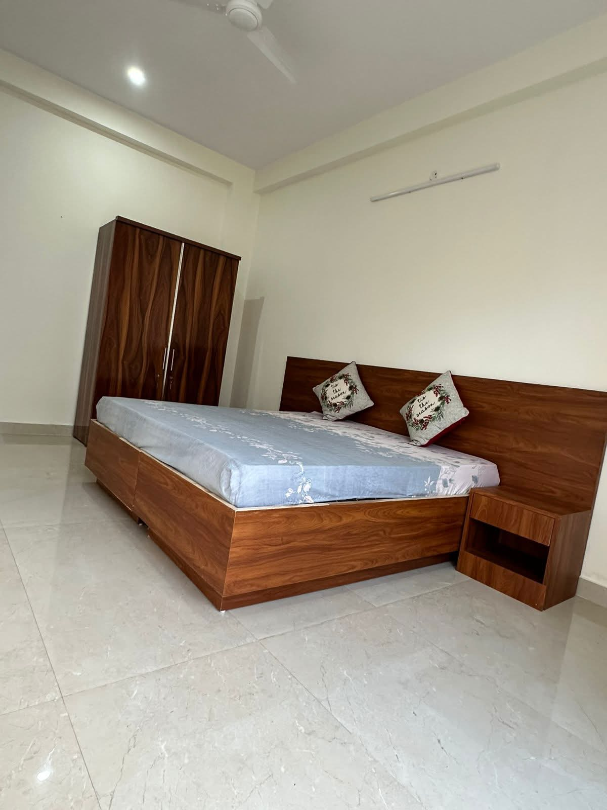 Spacious bedroom with wooden furniture